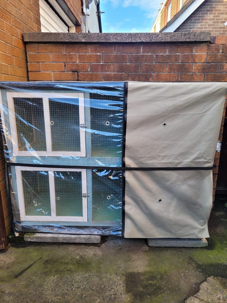 2 storey rabbit hutch with thermal rain cover.