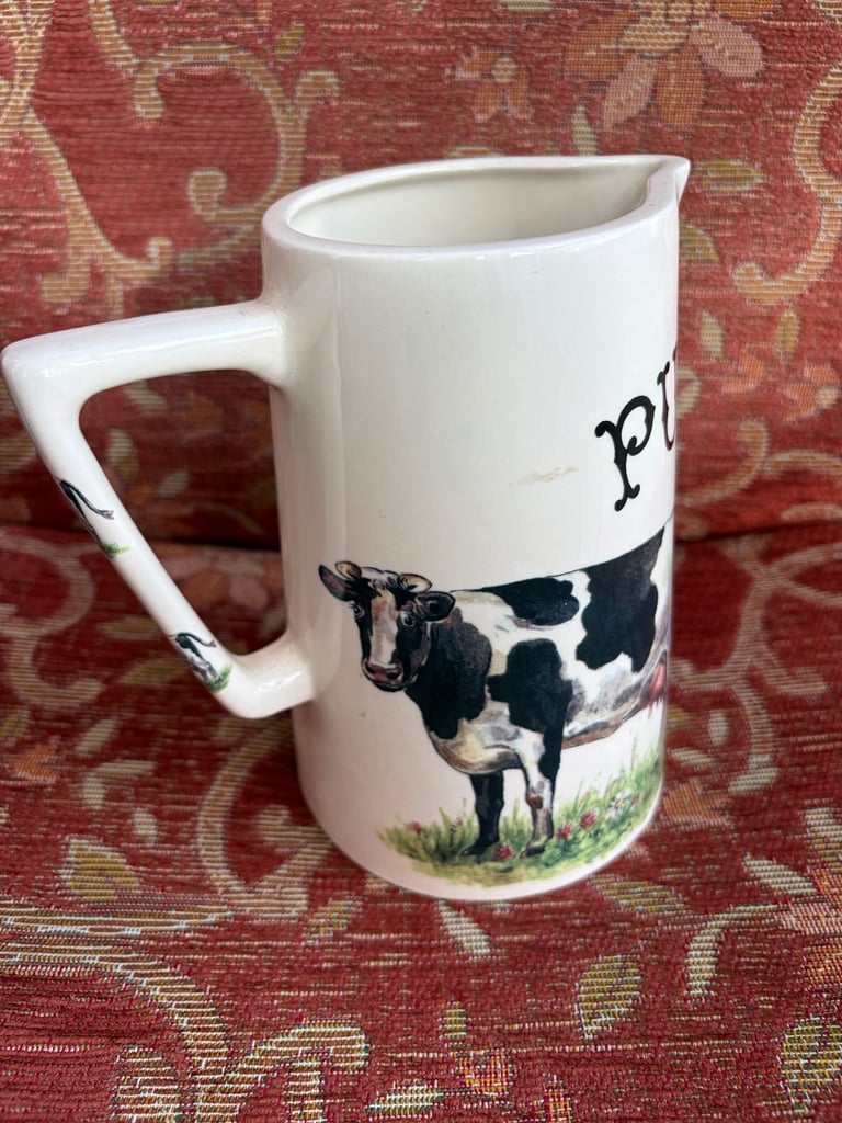 Ceramic milk jug with cow illustration
