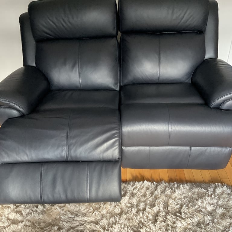 REDUCED PRICE    NEW 2 x 2 seater leather sofas 1 of which is a power recliner