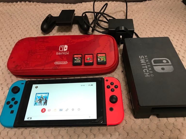 Nintendo Switch console with 3 games