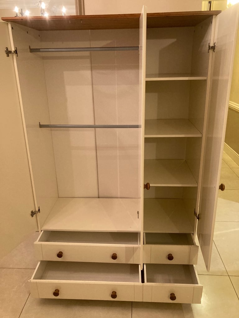 Triple door wardrobe and matching chest of drawers.