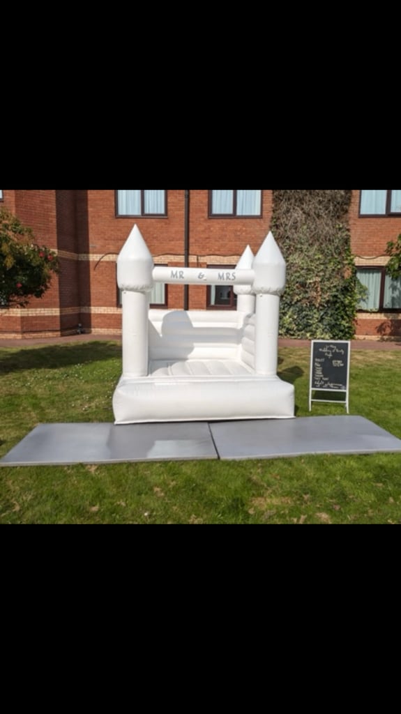 Luxury white bouncy castles with matching ball pool and soft play 