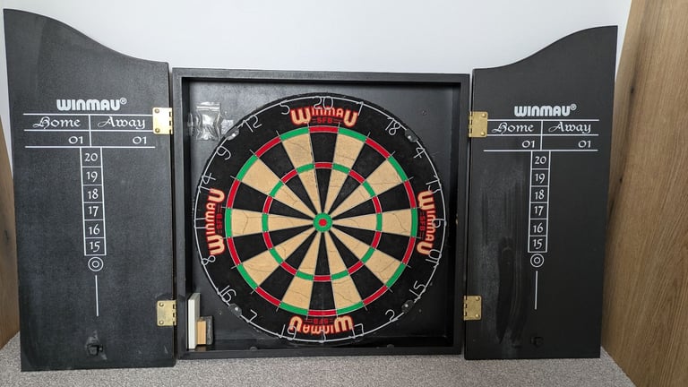 Vintage 1980's Winmau dartboard and Wooden cabinet with 3 sets of darts