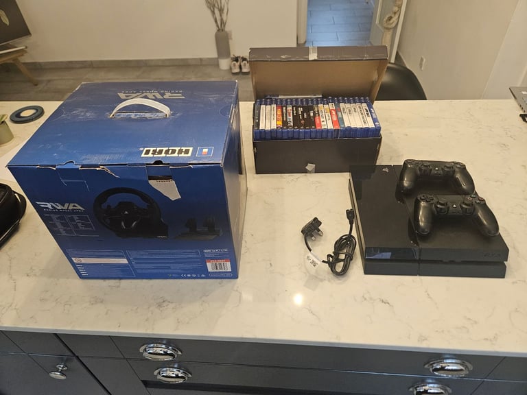 PlayStation 4 500gb with hori apex wheel and 23games