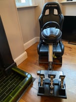 PlayStation seat with racing wheel and pedals