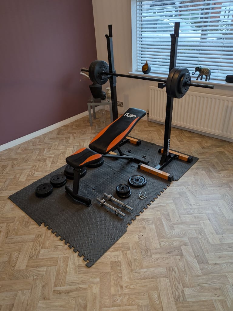 Gym bench, squat rack and weights 