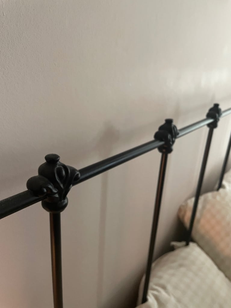 Elegant iron bed frame in vintage style 