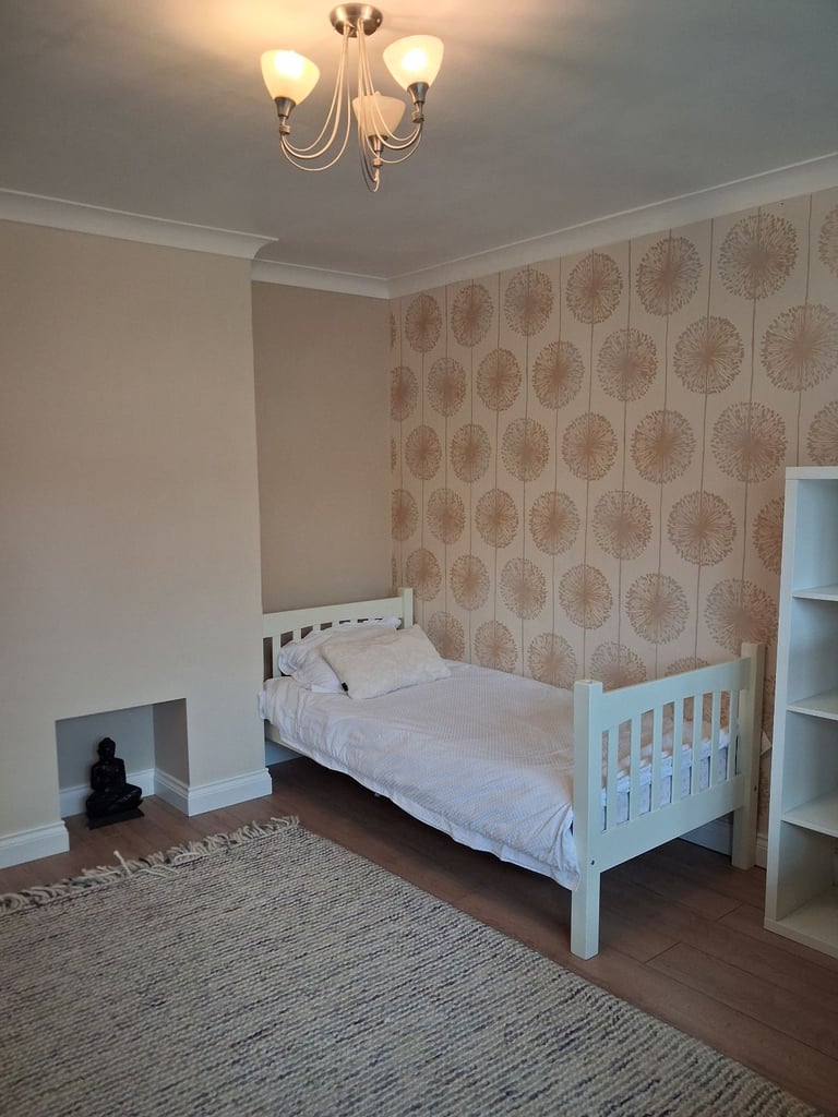 Spacious sunny bedroom with bay window 