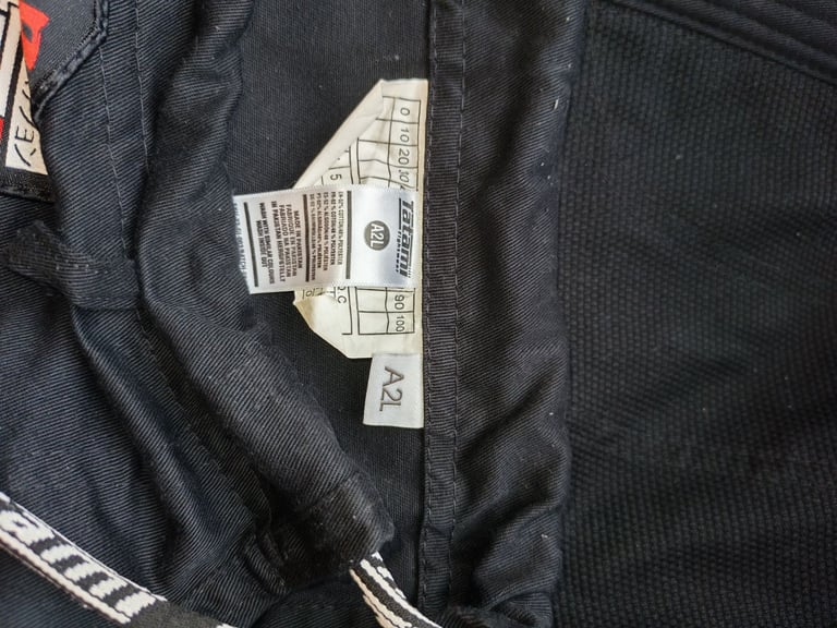 Tatami™  bjj gi with white belt, size A2L, used less than a week.  