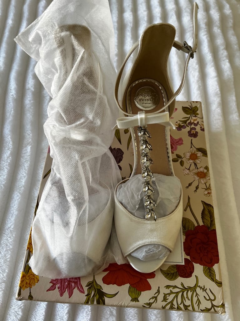 White satin heeled shoes