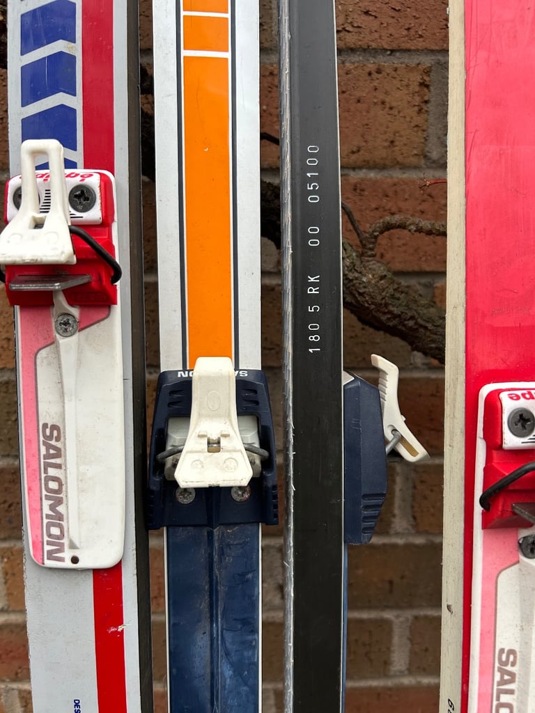 Various cross country skis, poles and boots