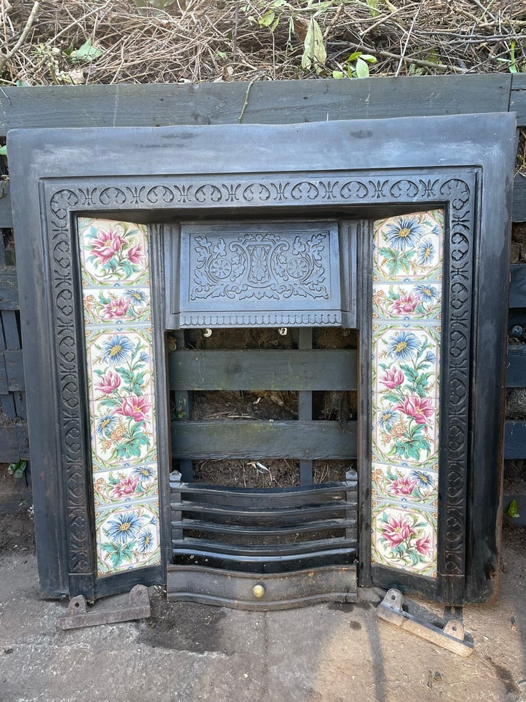 Cast Iron Fireplace with floral tiles.