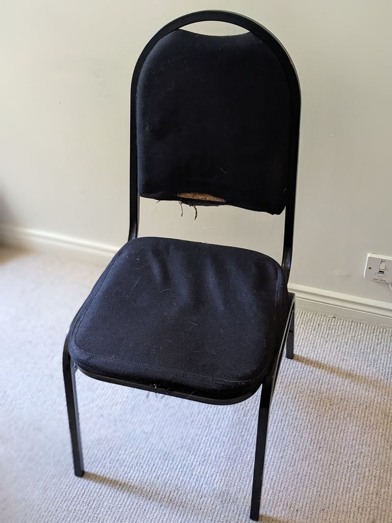 Four black office chairs - stackable 