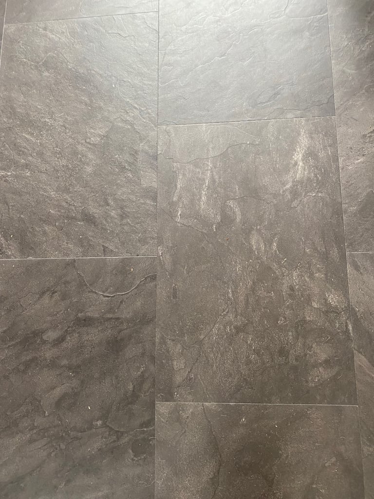 Laminate slate grey tile effect flooring 