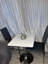 Brand new table can sit 4 chairs around it 