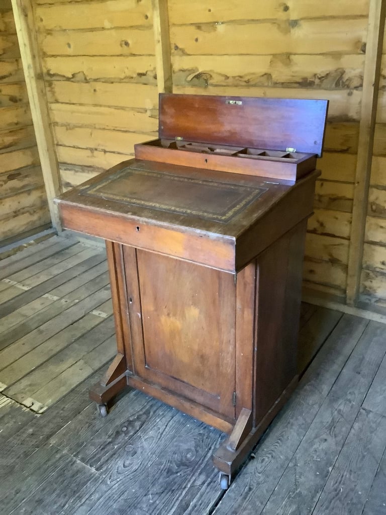 Victorian walnut brown leather insert davenport with ink wells & wheel castors