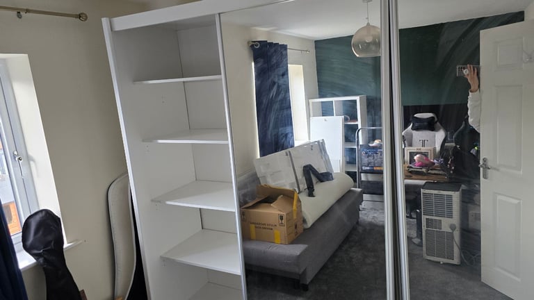 Spacious wardrobe with sliding doors