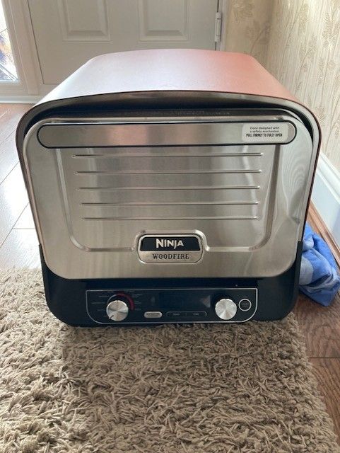 image for Ninja Woodfire Electric Outdoor Oven, Artisan Pizza Maker and BBQ Smoker