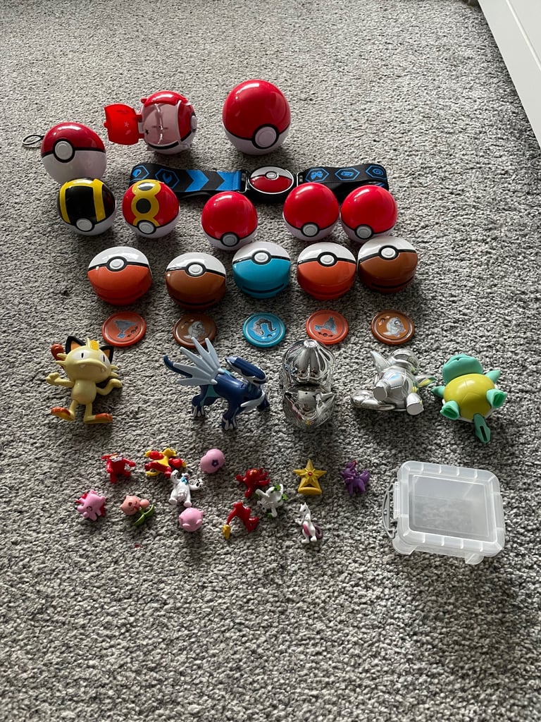 Job lot of pokemon balls figures belt disc launchers