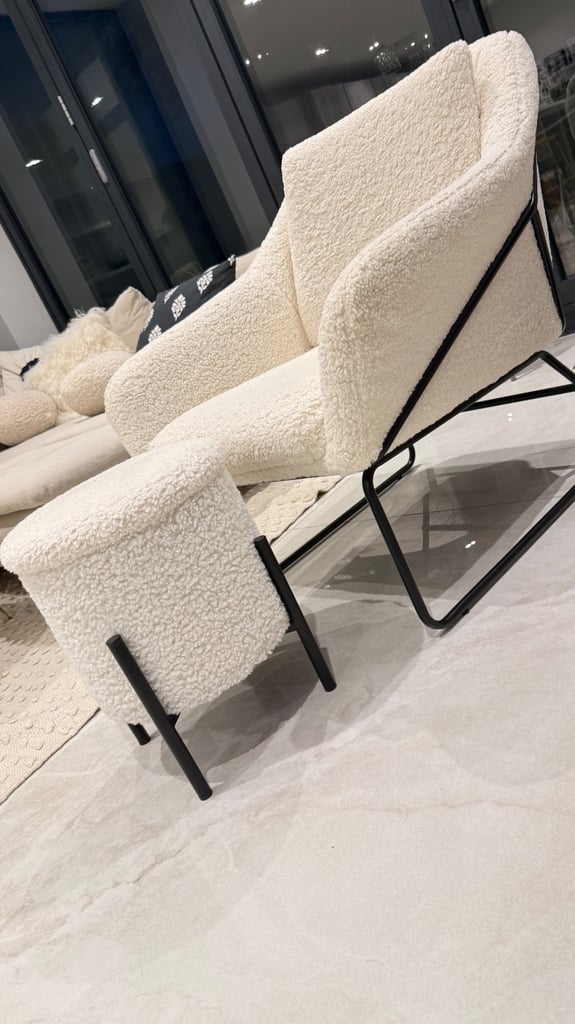 Boucle arm chair with foot rest