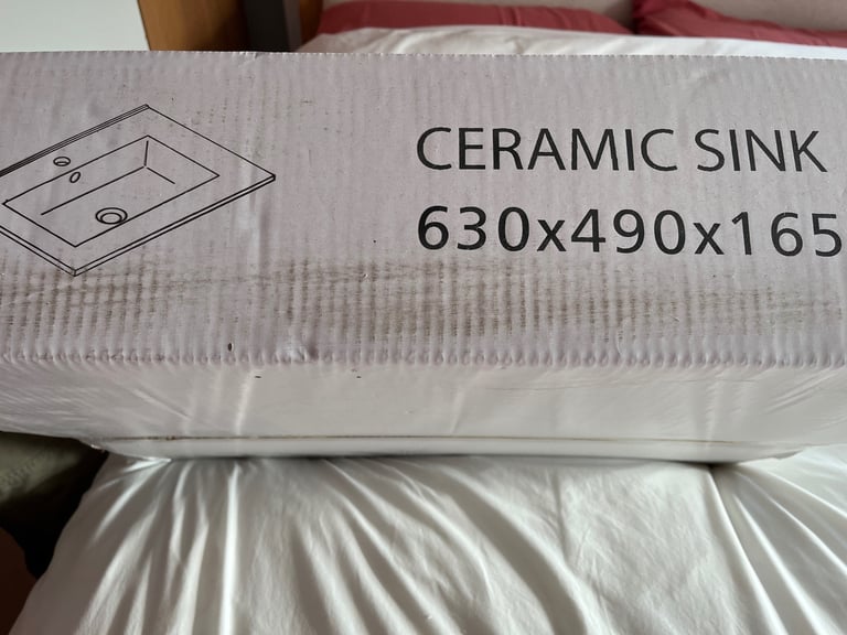 image for White ceramic bathroom sink and vanity unit