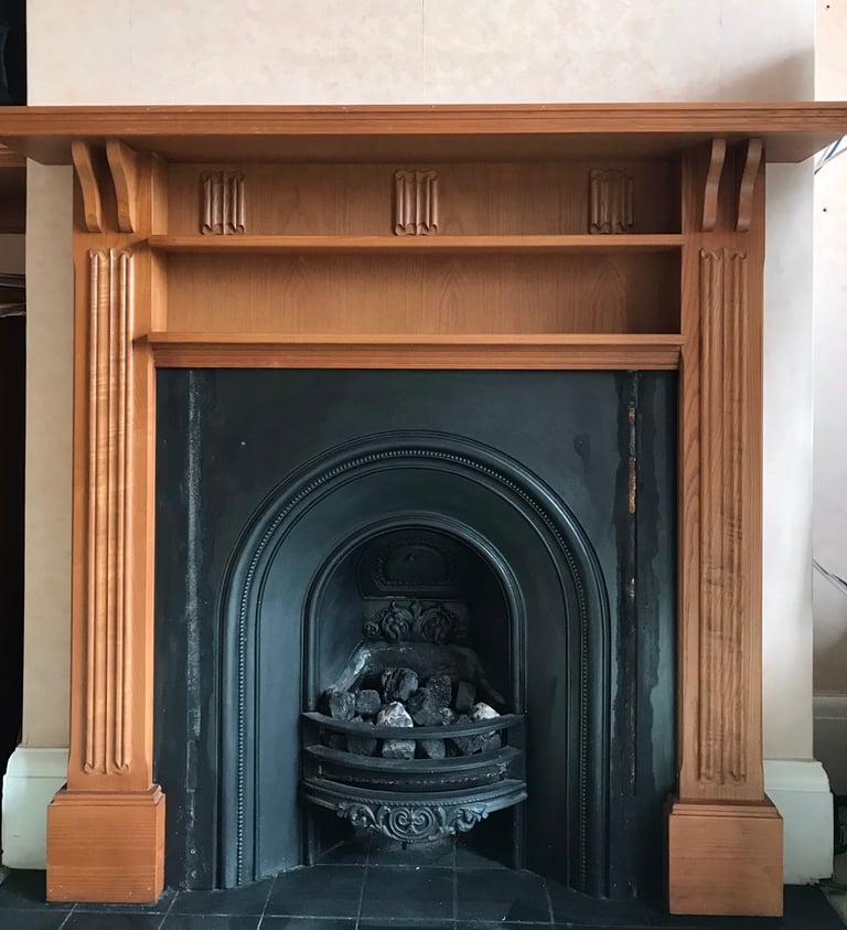 Cast Iron fireplace and solid wood surround 