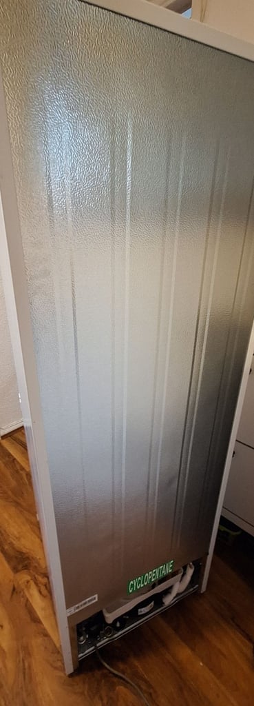 LOGIK fridge freezer size  H 142cm like new one year old 