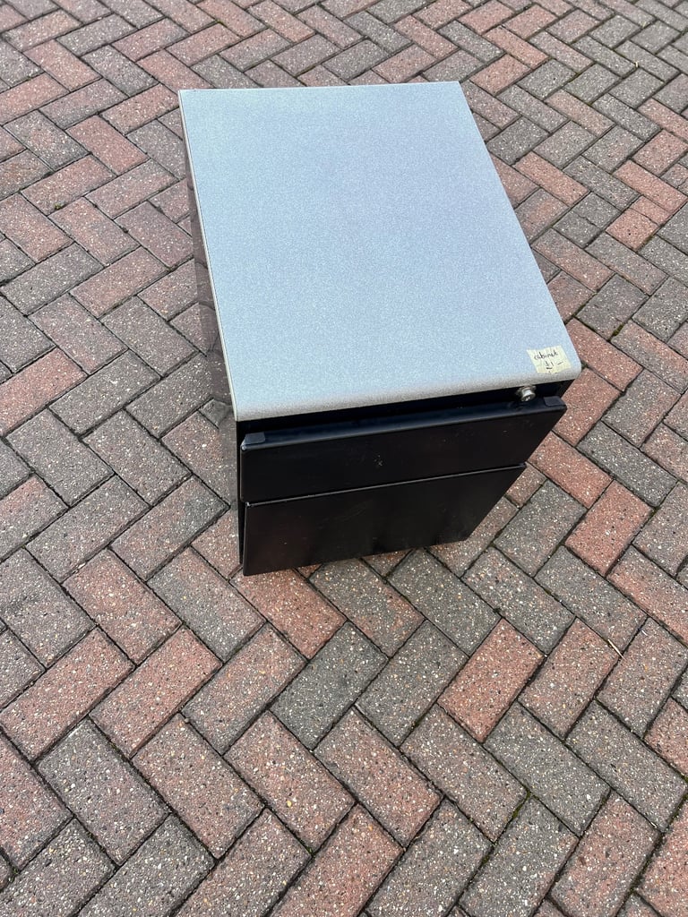 Filing cabinet / storage with 2 drawers black metal with grey worktop. 