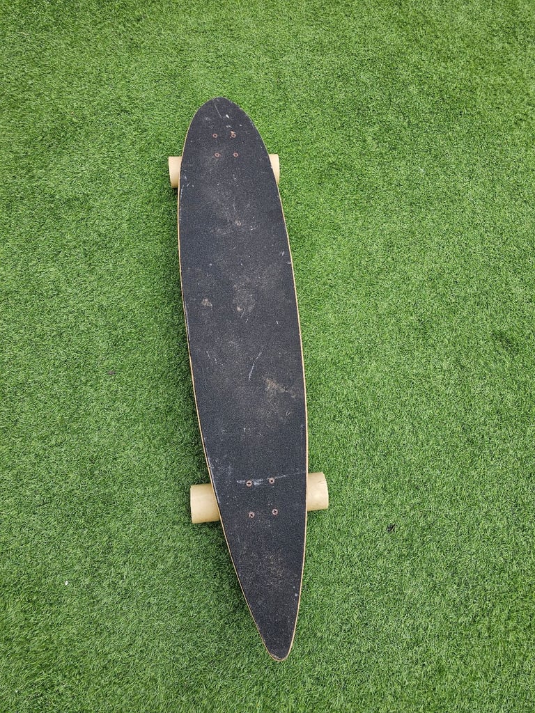 Two bare feet longboard skateboard 
