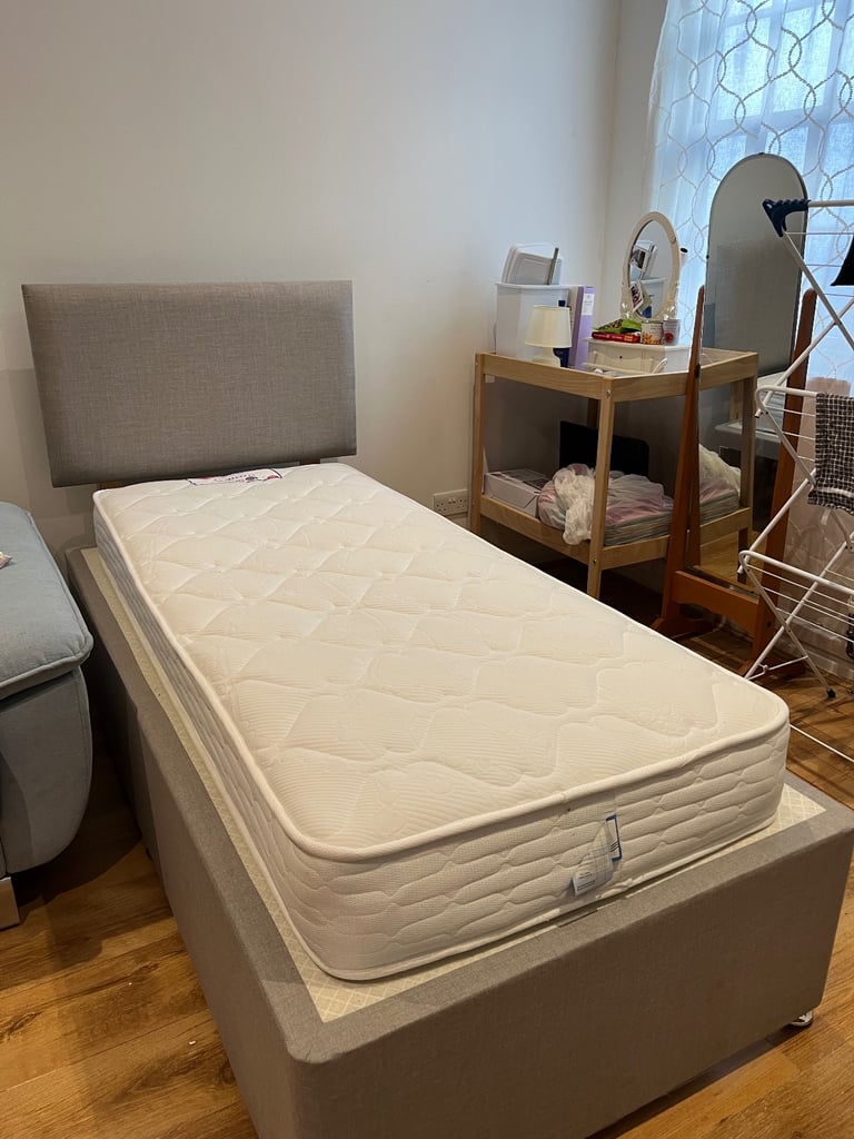 Single grey bed with new mattress 