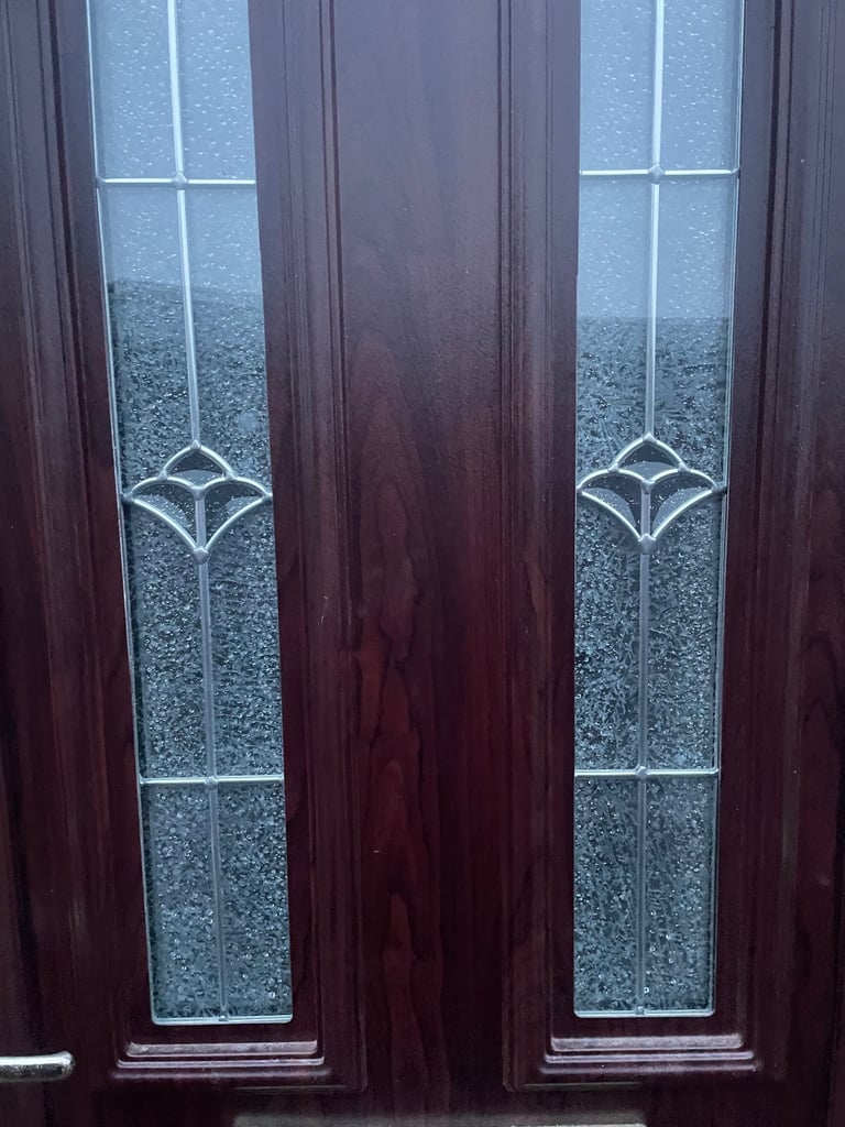 Upvc front door in rosewood 