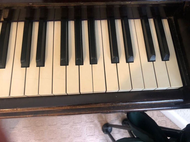 Upright Piano by Stanley Brinsmead London, 7 Octaves, 88 keys, dark wood.  Good condition.
