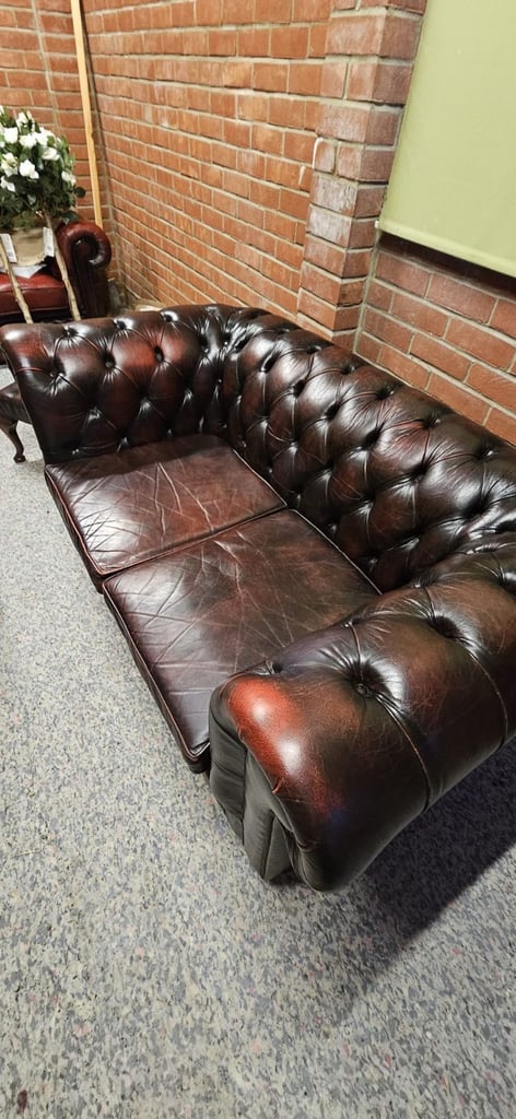 Beautiful vintage 2 seater chesterfield sofa with matching footstool.