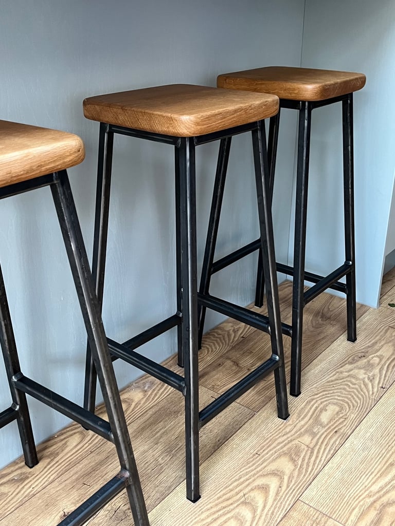 3 oak topped steel frame bar stools