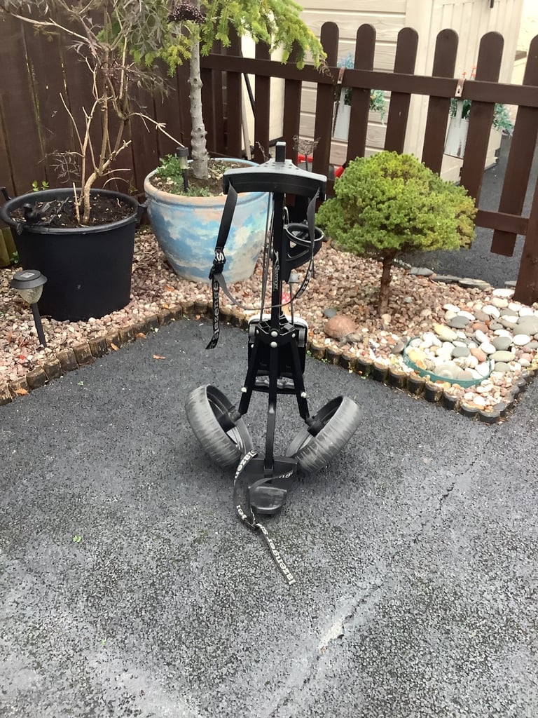 A lovely black Slazenger push/pull 2 wheel golf trolley.