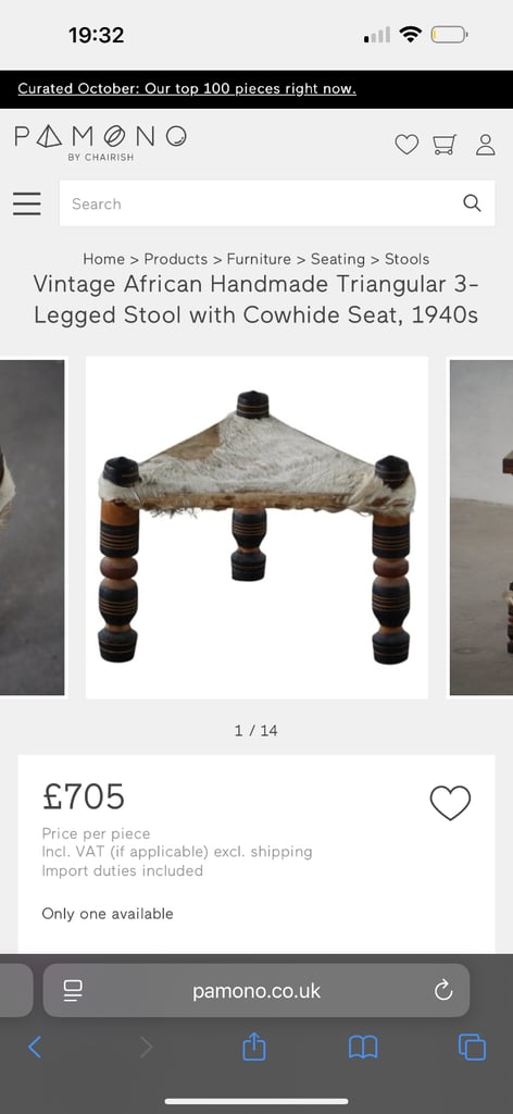 A Vintage Handmade 3 legged stool with cow hide seat.