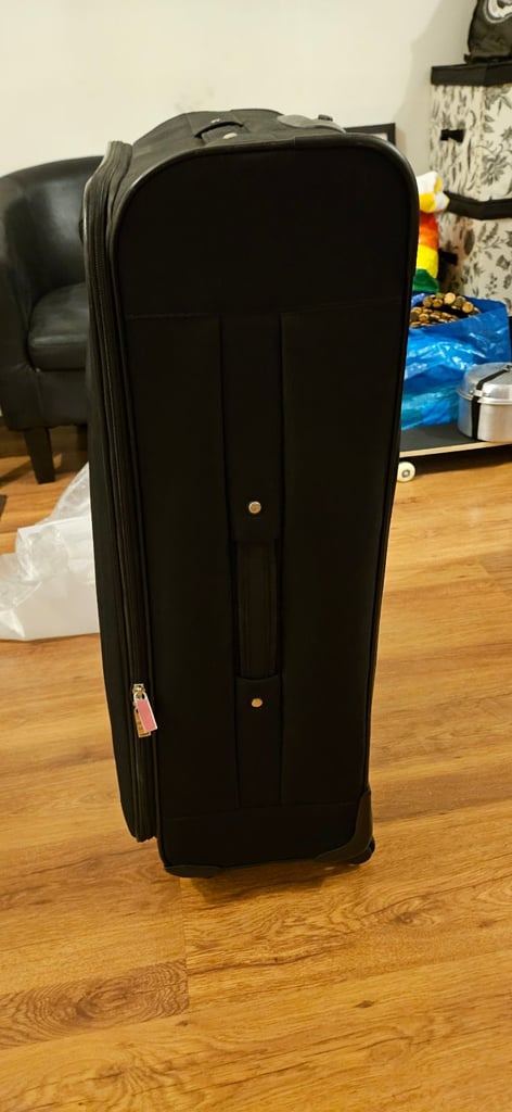 Trip LARGE Suitcase with extra small bag.