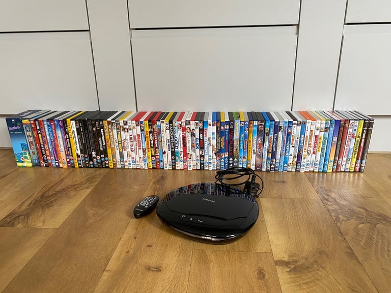 Samsung DVD player with remote and 85 DVDs
