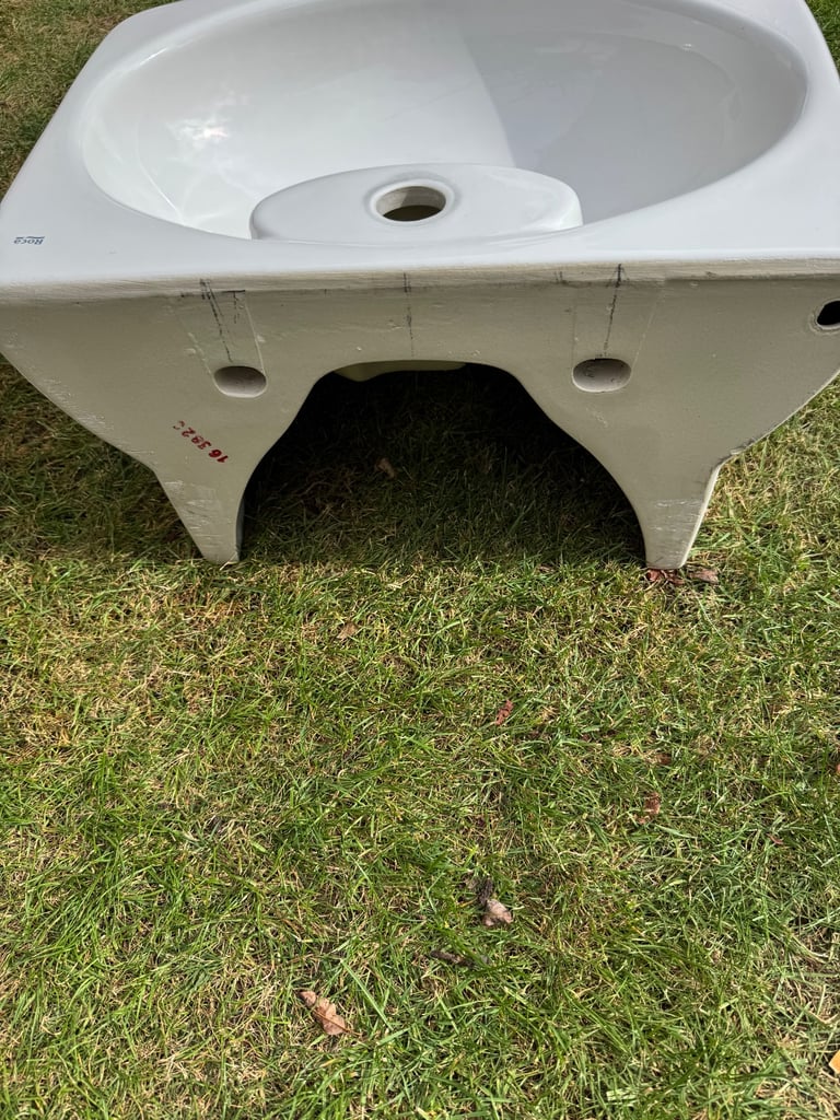 Roca brand white ceramic wall hanging cloakroom sink.  