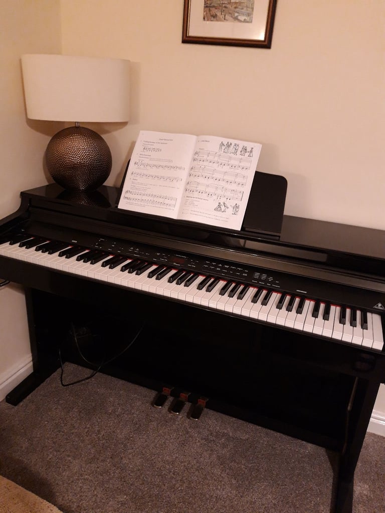Piano Concert Electric with high glossy black lacquer finish. 