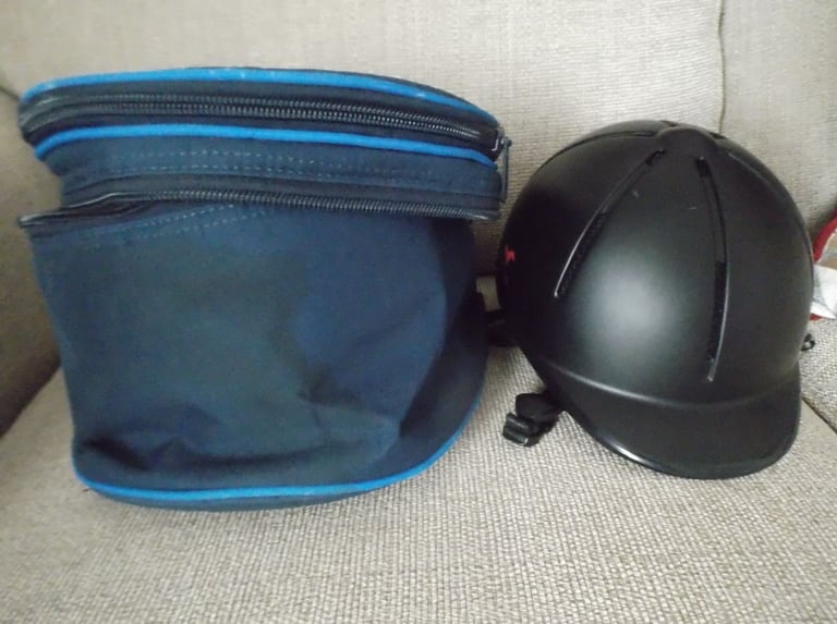 Childs horse riding safety helmet and storage bag