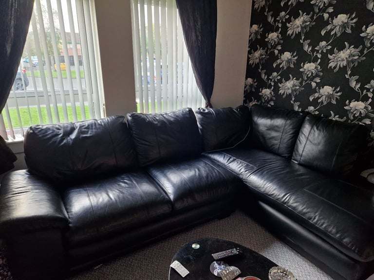 Black leather corner sofa ( SOLD PENDING UPLIFT )