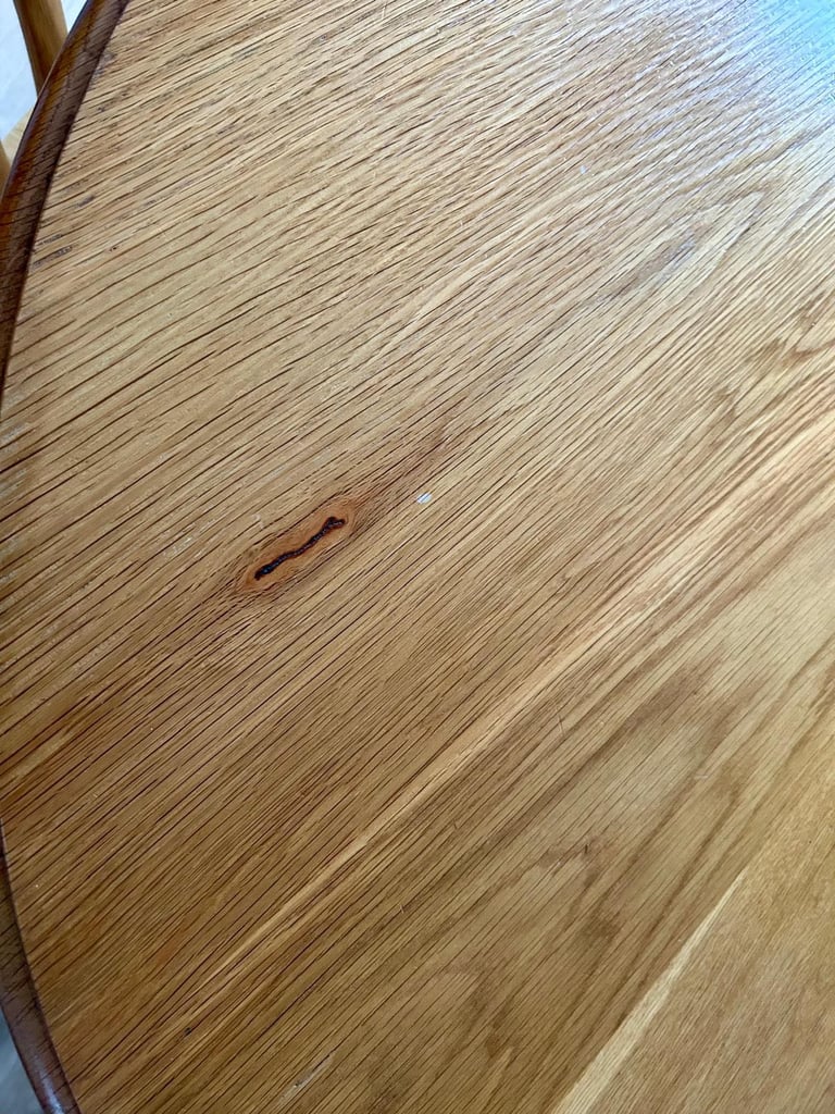 Solid oak dining table and four chairs