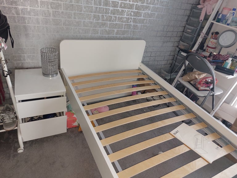 Single bed in white colour with bedside 