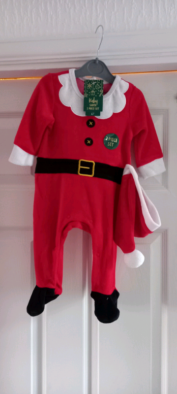 Babys santa suit still tagged 3/6 months 