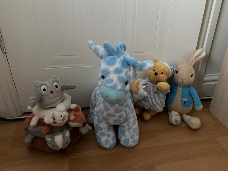 Selection of soft toys inc Peter rabbit bunny, giraffe, Winnie the Pooh and animal stacking ring