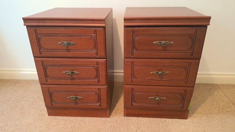 A matching pair of bedside cabinets with 3 drawers in each