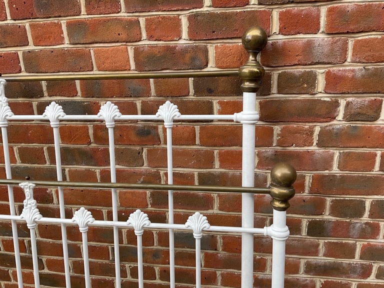 White wrought iron bedstead
