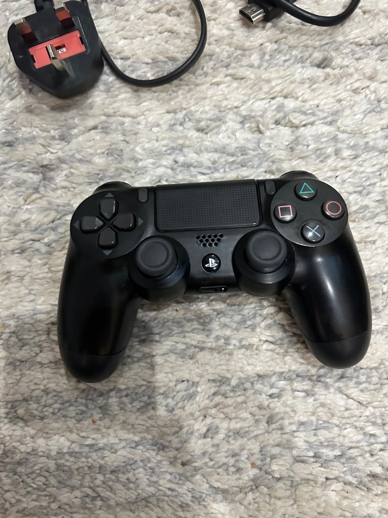 PS4 with controller and wires 