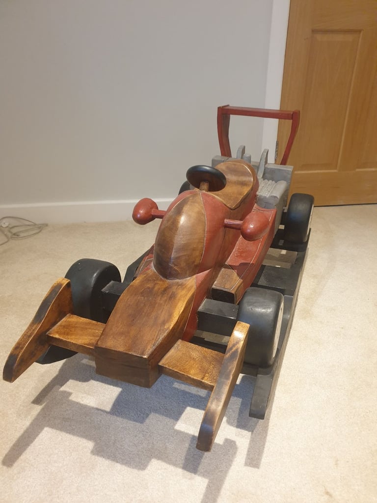 Solid wood rocking car